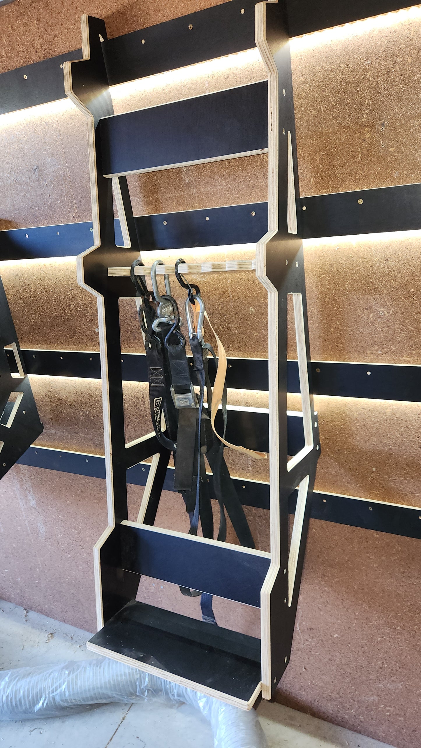 MX - loading ramp storage + tie down storage.
